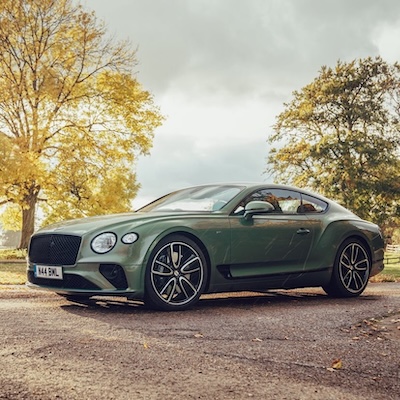 Stopped at the kerb by a Bentley